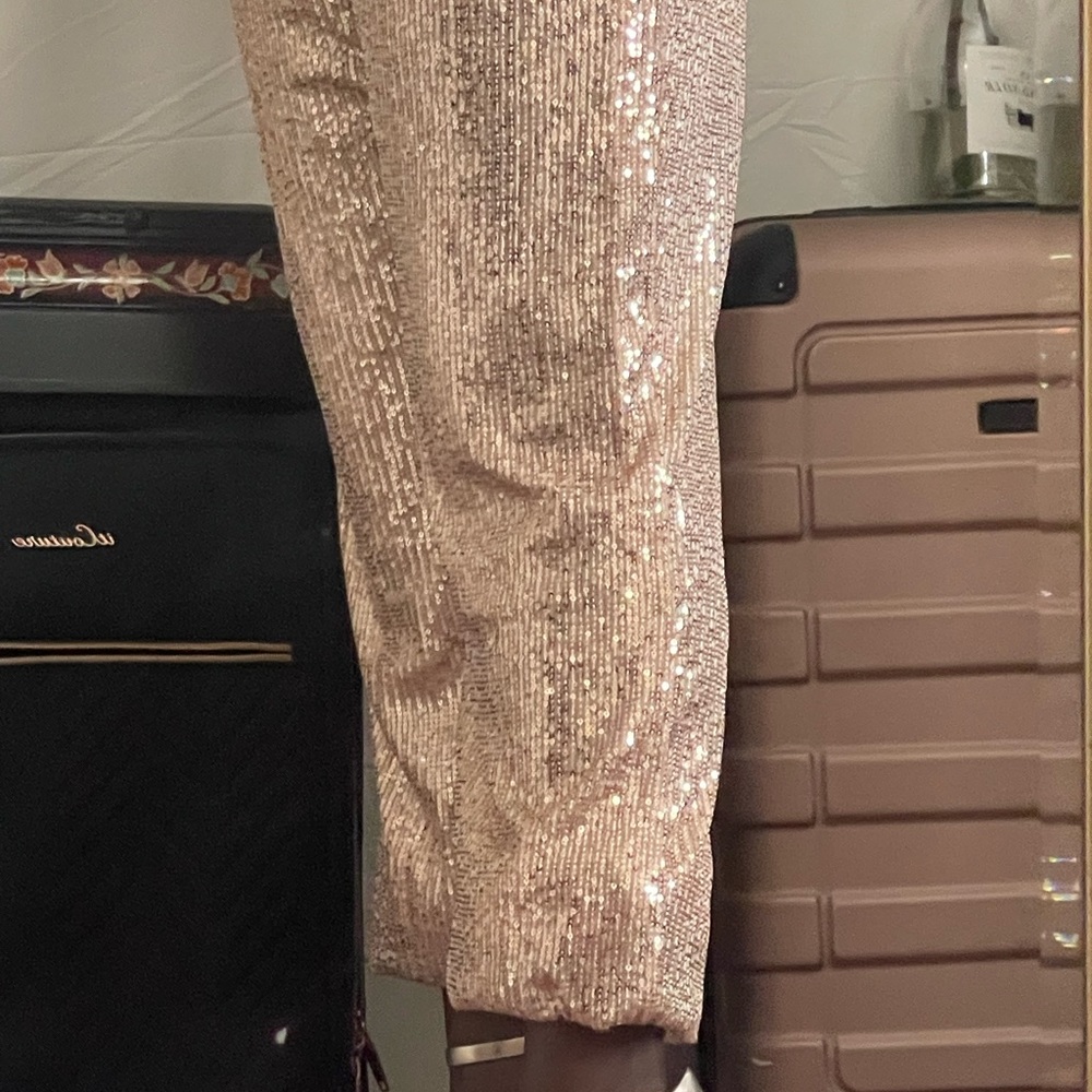 Size Large with elastic waist line sequins pants.